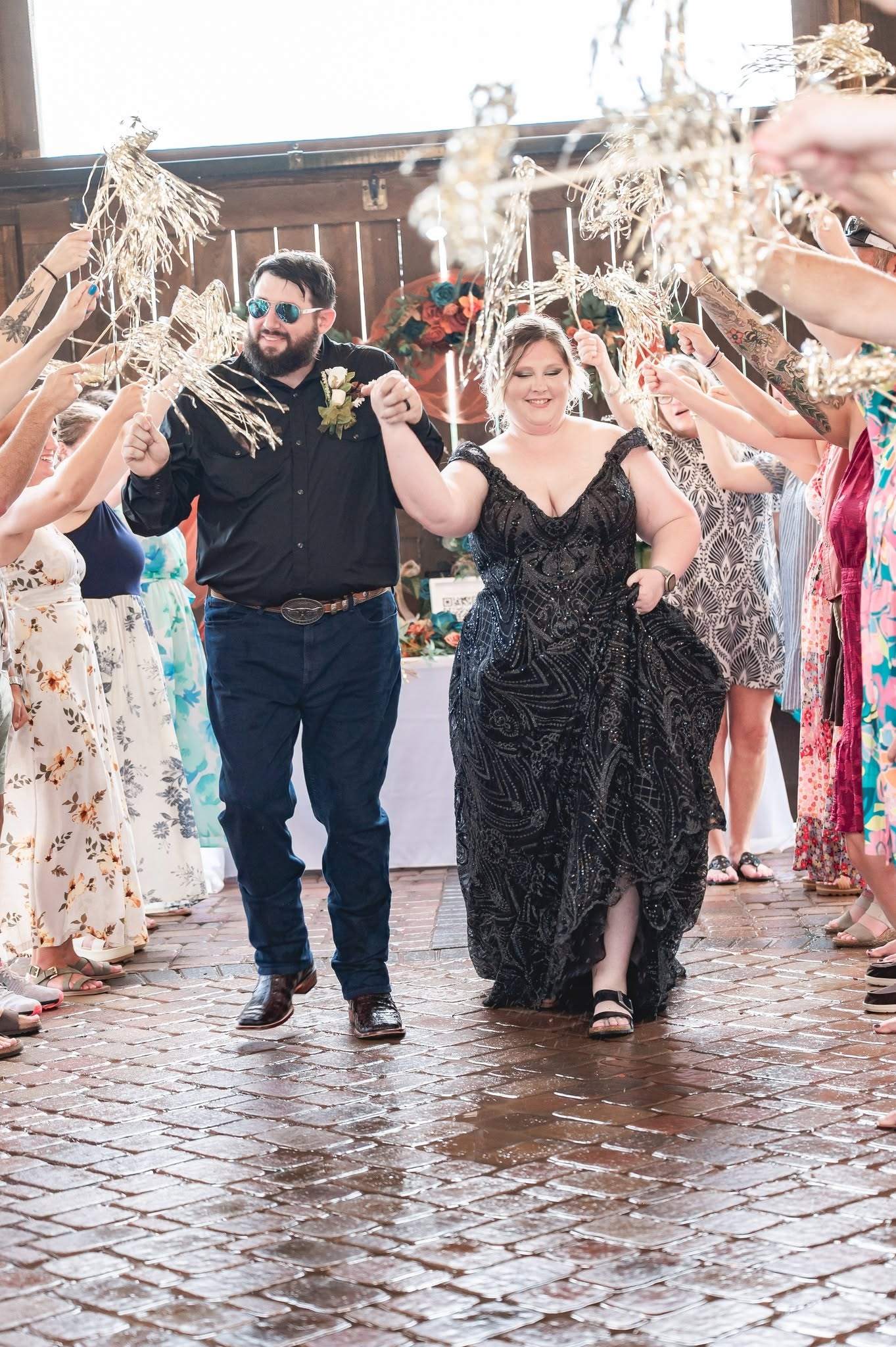 Wedding couple walking through celebration exit